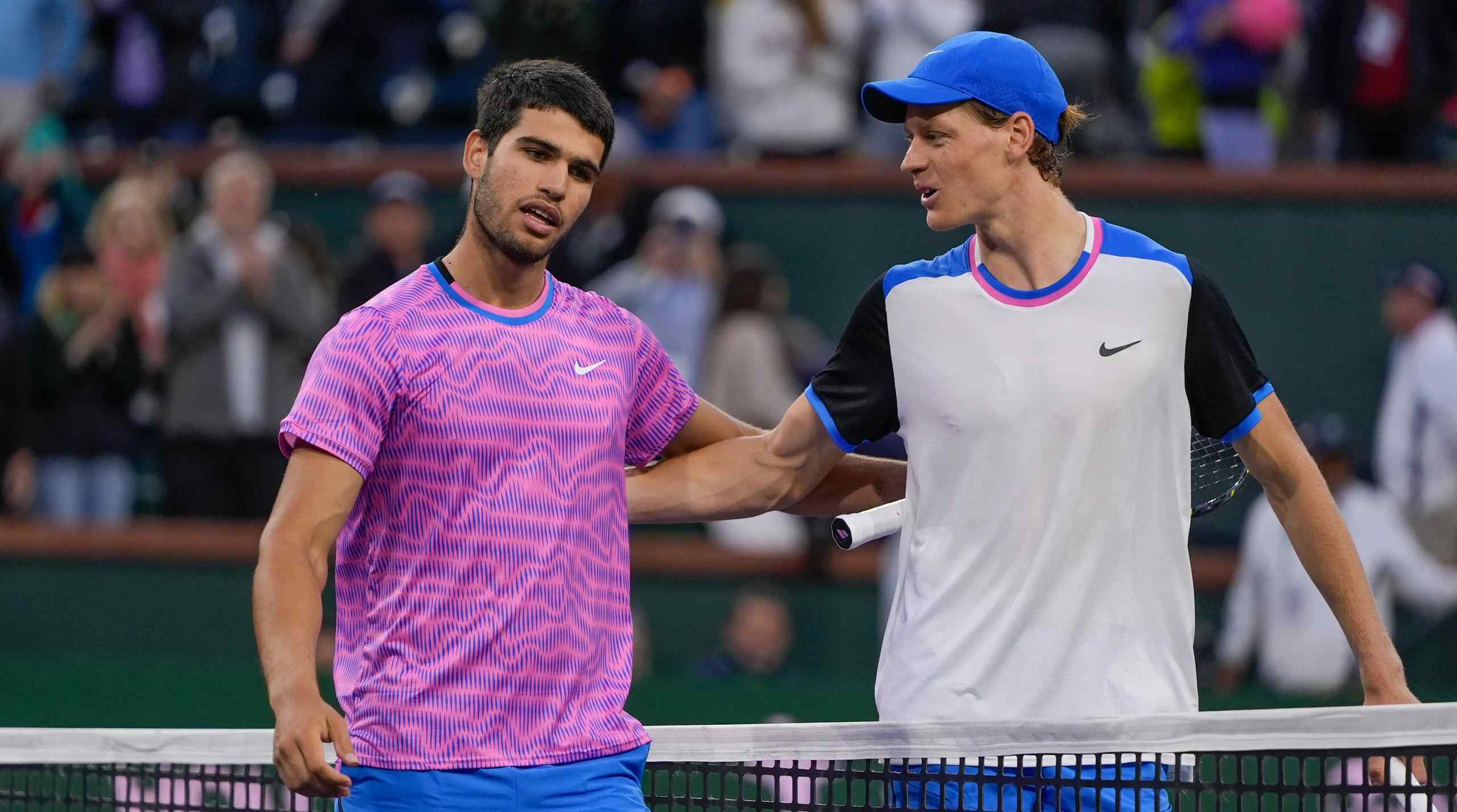 Jannik Sinner vs. Carlos Alcaraz greet each other after a match.